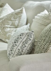 Embroidered Accent Pillows On Light Sofa
