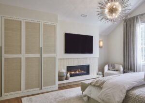 Primary Bedroom Fireplace Design With Mounted Tv